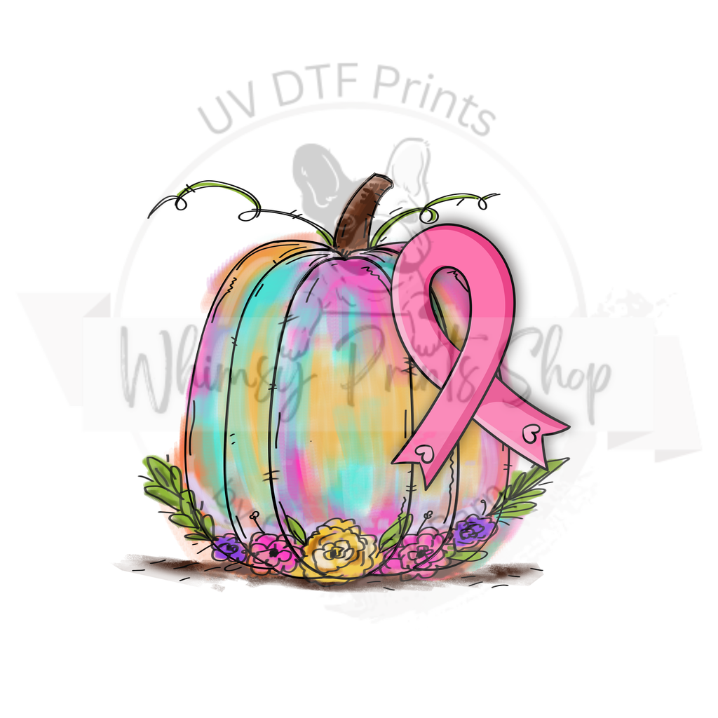 a pumpkin with a pink ribbon on it