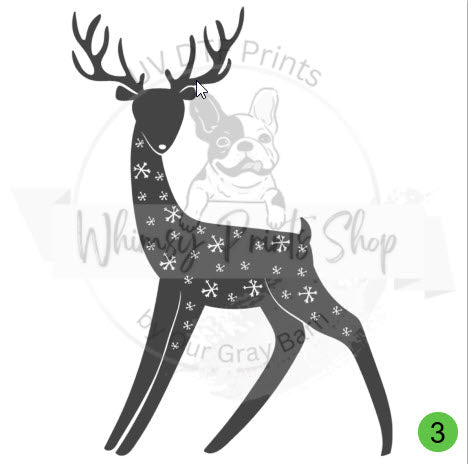 a black and white deer with snowflakes on it's antlers